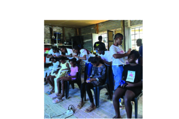 Young entrepreneur uses hair skills to help schoolchildren