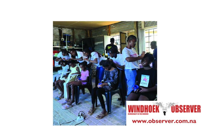 Young entrepreneur uses hair skills to help schoolchildren