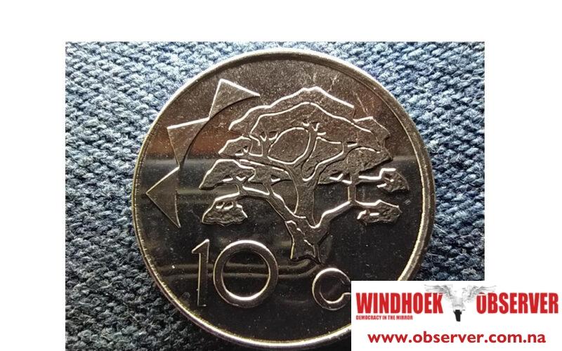 Ten cent coin under pressure